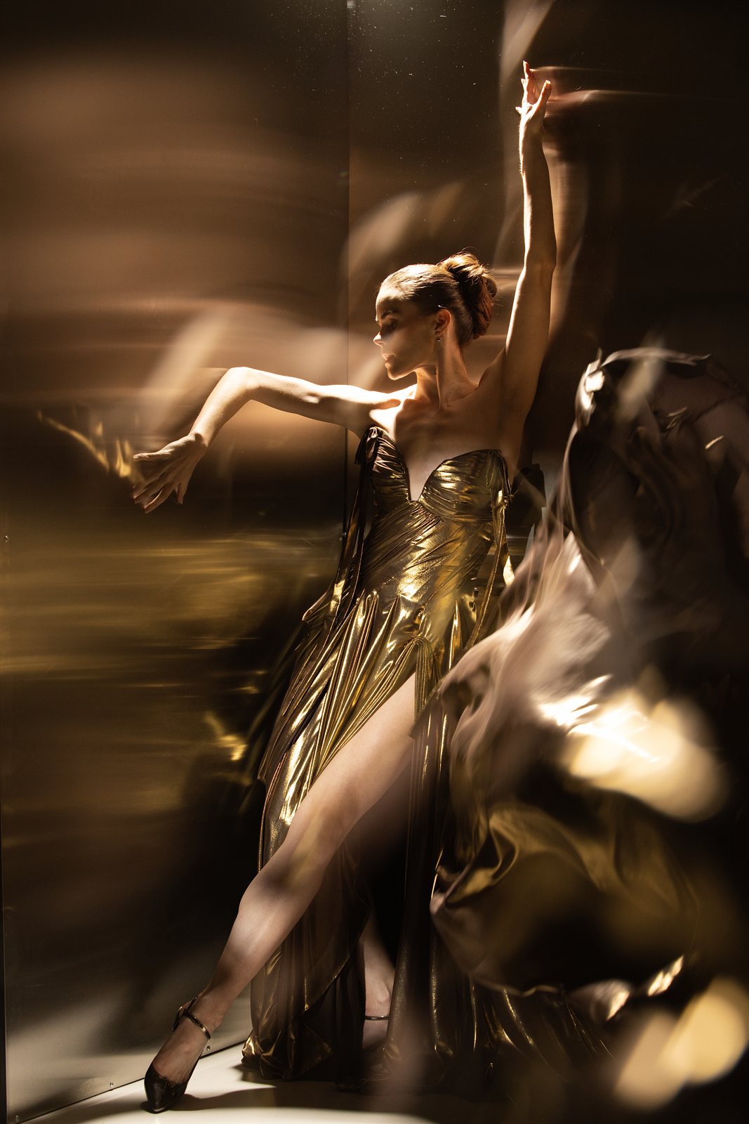Ashkan Studios - subject in motion on teal backdrop